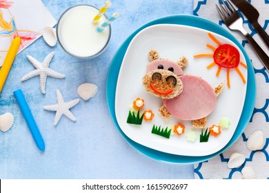 Fun Food For Kids - Cute Smiling Hippo Sandwich With Ham And Toast Bread Decorated With Carrots, Cucumbers And Tomatoes For Lunch. 