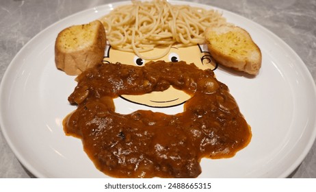 Fun Food Presentation on Cartoon Face Plate with Spaghetti Bread and Meat Sauce for Kids Meal - Powered by Shutterstock