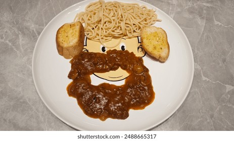 Fun Food Presentation on Cartoon Face Plate with Spaghetti Bread and Meat Sauce for Kids Meal - Powered by Shutterstock