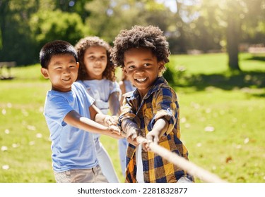 Fun, games and kids playing tug of war together outdoor in a park or playground in summer. Friends, diversity and children pulling a rope while being playful fun or bonding in a garden on a sunny day - Powered by Shutterstock