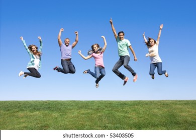 Fun Group of Young People Jumping Outdoors