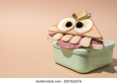 Fun Halloween monster sandwich with slice ham, eggs and cheese