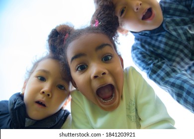 Fun. Interracial Group Of Kids, Girls And Boys Playing Together At The Park In Summer Day. Friendship Has No Race. Happiness, Childhood, Education, Diversity Concept. Look Happy And Sincere.