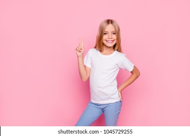 Fun joy enjoy people person funtime concept. Portrait of cute lovely carefree confident sweet adorable beautiful girl in casual modern outfit demonstrating v-sign isolated on pink background - Powered by Shutterstock