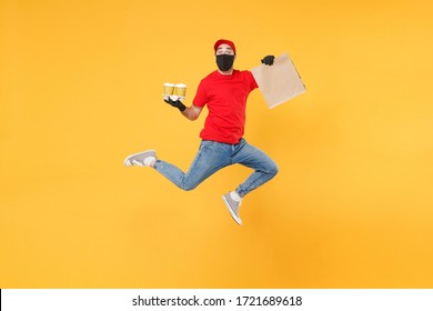 Fun Jumping Delivery Man Guy Employee In Red Cap Mask Gloves Hold Craft Paper Packet Food Coffee Isolated On Yellow Background Studio. Service Quarantine Pandemic Coronavirus Virus 2019-ncov Concept