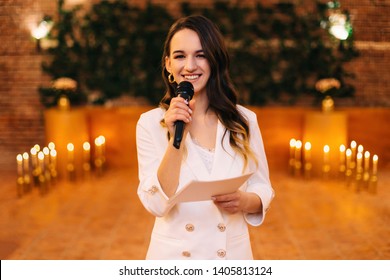 Fun Master Of Ceremonies With Microphone In Hall