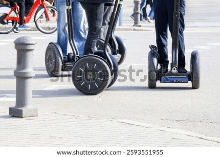 Fun on two wheels. Road safety. Alternative transport. People riding Segway in the city. Environmental protection. Harmless transport. Types of transport. Segway