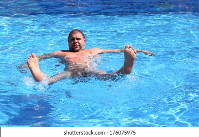 Fun Overweight Man Bathing In Pool