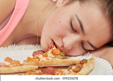 Fun Sad Overeat Girl Lying With Pizza Pieces