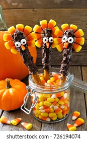 Fun Thanksgiving Turkey Pretzel Sticks With Candy Corn, Still Life Against A Wood Background