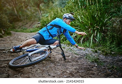 Its Fun Until You Fall. Shot Of A Male Cyclist Whos Taken A Fall On His Mountain Bike.