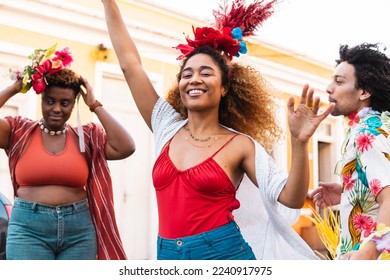 Fun woman dancing Carnival in the street. Brazilian people enjoying Carnaval festival in Brazil - Shutterstock ID 2240917975