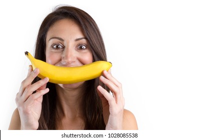 Fun Woman Making Banana Smile On White Background Isolated