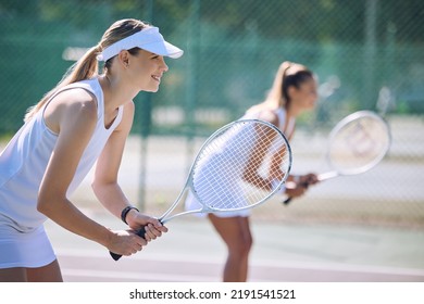 Fun women playing tennis match, practicing for competition and getting ready for sporty fitness game on a court outside, Female friends and teammates doing cardio training and sports workout - Powered by Shutterstock