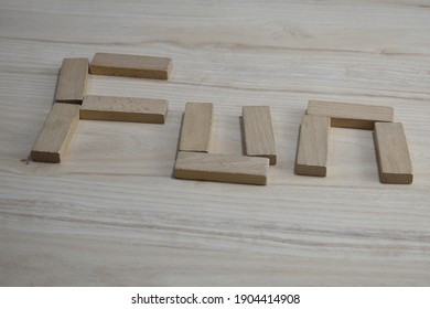 Fun Word Written With Wood Blocks And Toys. Wooden Word. Happy Time With Family. Kids Play With Healthy Wood Toys For Funny Time With Non-sentetic And Non-plastic Toys At Home. Home Activity.