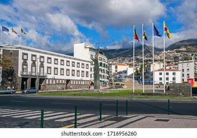 Funchal, Portugal -  November 10, 2019: Autonomy Square, Building Of The Customs Office Alfandega Do Funchal  And The Monument By Ricardo Velosa Celebrating The Autonomy Of Madeira