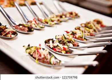 function food; a platter of function food on spoons