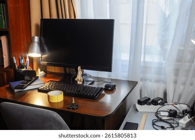 A functional home office setup with a computer and workspace essentials under