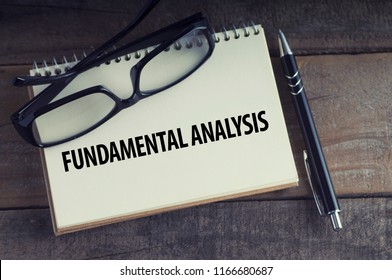 Fundamental Analysis Word With Notebook, Pen And Glasses