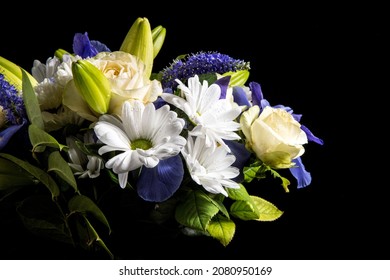 Funeral Bouquet Purple White Flowers, Sympathy And Condolence Concept On Blackbackground With Copy Space.