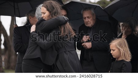 Funeral, crying family and people hug for grief support, mourning depression and death at emotional burial event. Kid child, mom and group together with widow hugging senior mother at coffin ceremony