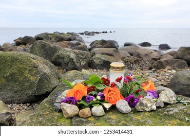 Funeral Decoration On A Rock As Burial At Sea Concept