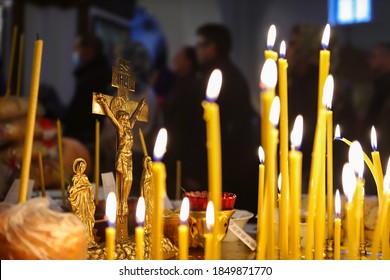 Funeral liturgy with prayer for the dead. Crucifixion, bread and candles in the Orthodox Church. The concept of Orthodoxy.
