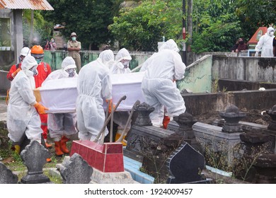 Funeral Procession Of Covid19 Corpses By Workers Wearing Hazmat Suits