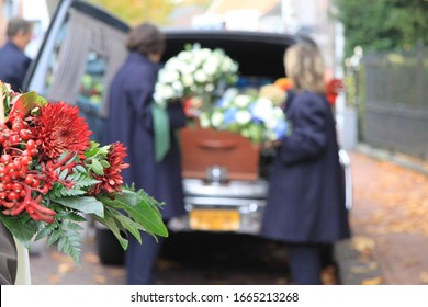 Funeral procession with flowers in car - Shutterstock ID 1665213268
