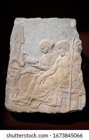 Funerary marble relief of Asklepios and his daughter Hygieia feeding a snake. Therme of Salonika. 5th century BC.