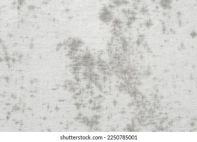 Fungus on weathered white cotton, old fabric cloth with dirty and mold.
