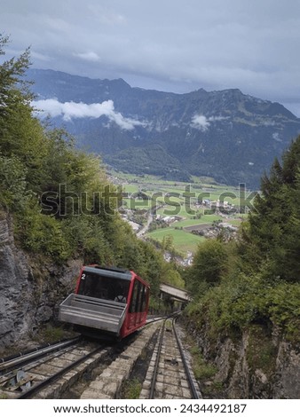 Funicular ride to the highest point in Interlaken Switzeland. Highest point is Harder Kulm with spectacular views of Swiss mountains and Interlaken