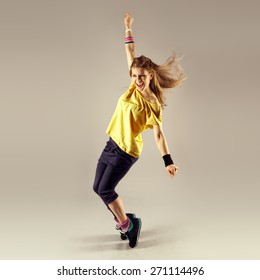 Funk dance workout. Portrait of young sporty woman in motion. Zumba