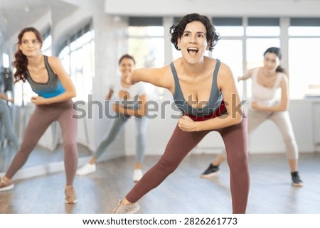 Funk jazz dancers practicing dance moves in the studio