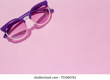 Funky Fashion Conception. Purple Sunglasses From Above. Flat Lay View.