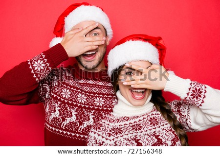 Funky fooling around and chill crazy, humor, comic mood. Festive youth bonding, so excited, in knitted cute traditional x mas costumes with ornament, head wear, lady has baired braided hair