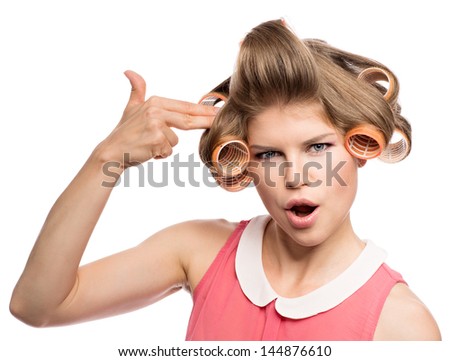 Funky girl in hair rollers. Attractive Caucasian blue eyed woman model with hair curlers isolated on a white background.