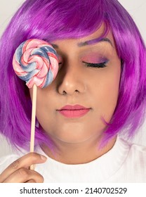 Funky Lady With Lollypop And Purple Hair. Pink Makeup, Swirl Lolly, Rock Lolly, Face Pose 