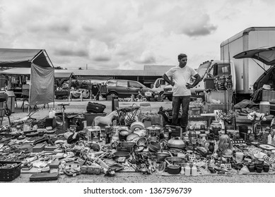 Funland Flea Market Tampa, Florida USA March 17, 2019: A Vendor Looking Over His Wares