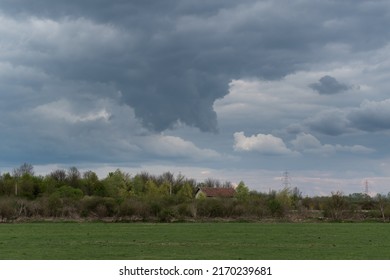 Funnel Cloud Above House In Countryside, Storm Cloud In Rural Area