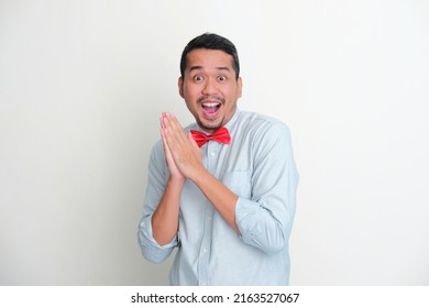 Funny Adult Asian Man Wearing Red Bow Tie Showing Excited Expression