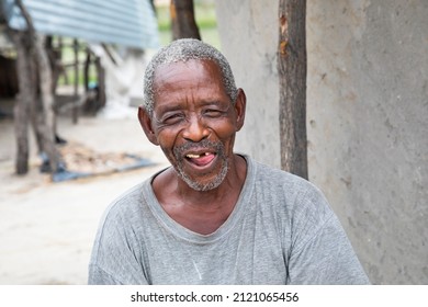 Funny African Old Man Smiling In The Yard Of His House In A Village In Botswana, 