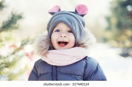 Funny Baby Laughing Outdoors In Winter Day