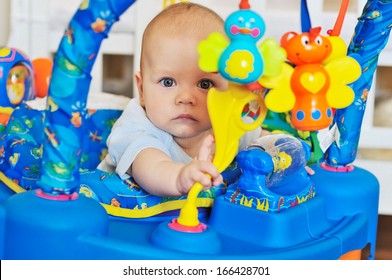 Funny Baby Playing In Baby Jumper