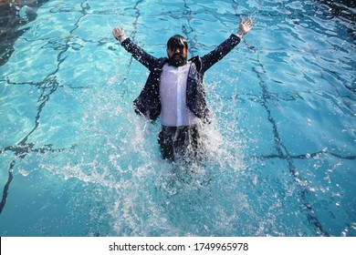 Funny Bearded Business Man In Suit In Swimming Pool. Happy Man With Dress In Swimming Pool. Fashionable Underwater Shooting