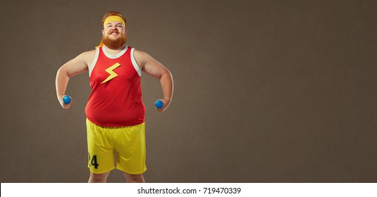 A Funny Bearded Fat Man Smiles In Sports Clothes.