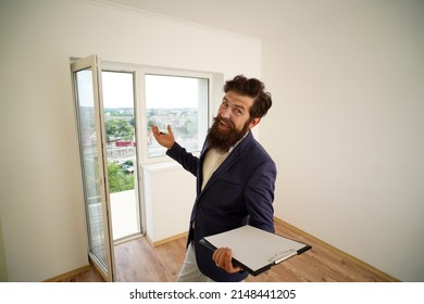 Funny Bearded Real Estate Agent With Clipboard Indoors. Moving Day.