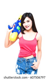 Funny beautiful woman shoot water gun on white isolate background on Songkran festival of Thailand