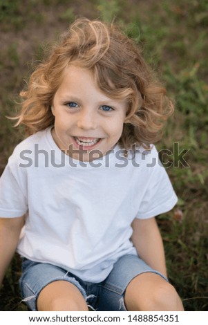 Similar – Small child with long blond hair enjoying of a sunny day