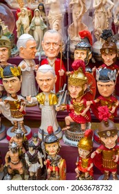 Funny Bobble Head Dolls Like Caesar And The Pope And Other Various Historical Figures From Rome, Italy.